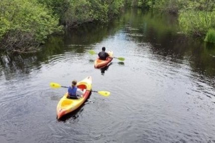 a man on a raft in a body of water